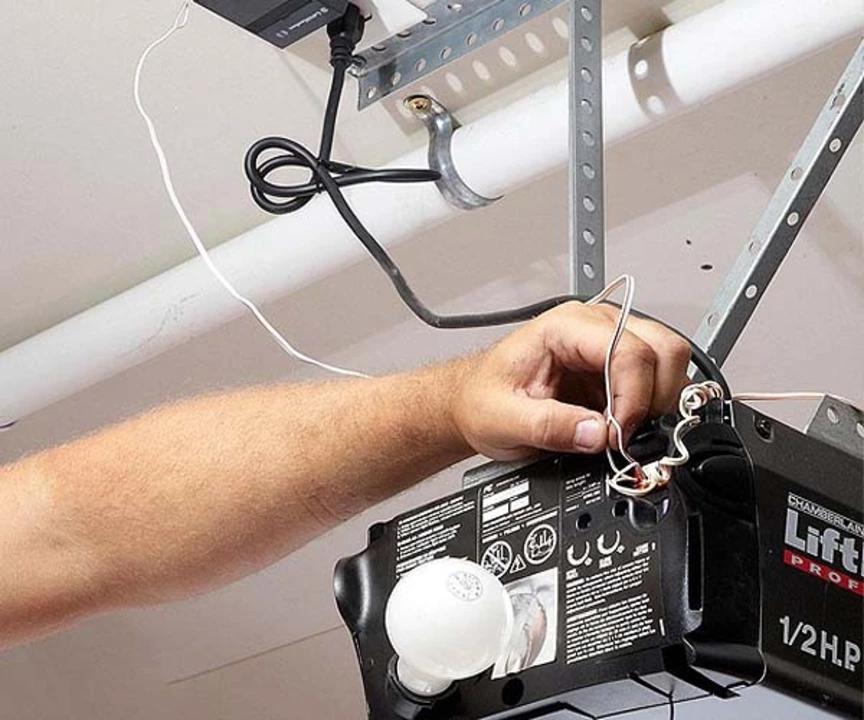 Damaged garage door opener wiring causing false signals